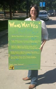 Lisa Wong holds WongWayVeg sign in Denver, Colorado