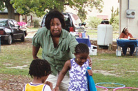 Childcare worker with two young children