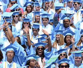 UNC students wearing caps and gowns at commencement