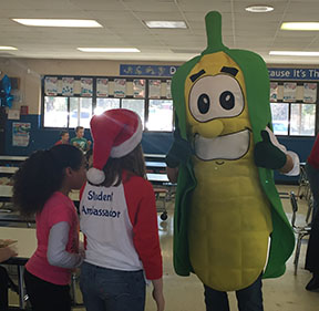 Teacher dressed up as corn interacts with students